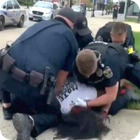 PHOTO: LMPD officer exonerated for repeatedly punching protester during arrest at Jefferson Square Park